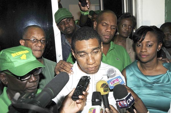 --- business social --

FACES OF THE WEEK
Gladstone Taylor / Photographer
Once again Andrew Holness is our face of the week. He is seen here facing reporters on Election night. He won back his seat but his party lost big.

----------------------------------------/





Jamaica Labour Party (JLP) Leader, outgoing Prime Minister Andrew Holness (centre) and (from right) his wife Juliet, party general secretary Aundre Franklyn, former Senator Arthur Willianms and MP designate for West Kingston Desmond McKenzie face the media at the JLP's Belmont Road headquarters last night.
