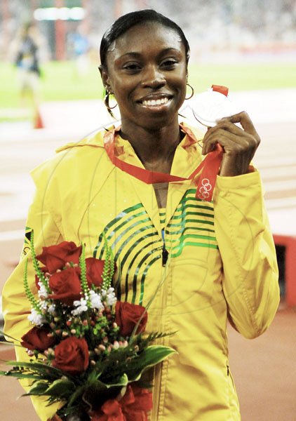 Shericka Williams 











shows off her silver medal at the beijing 2008 Olympics