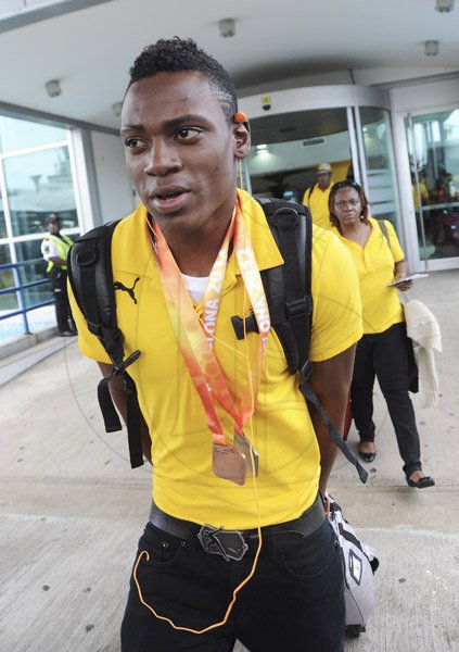 Ricardo Makyn/Staff Photographer
World Junior Team arrives at the Norman Manley International Airport from Barcelona Spain on Monday 16.7.2012