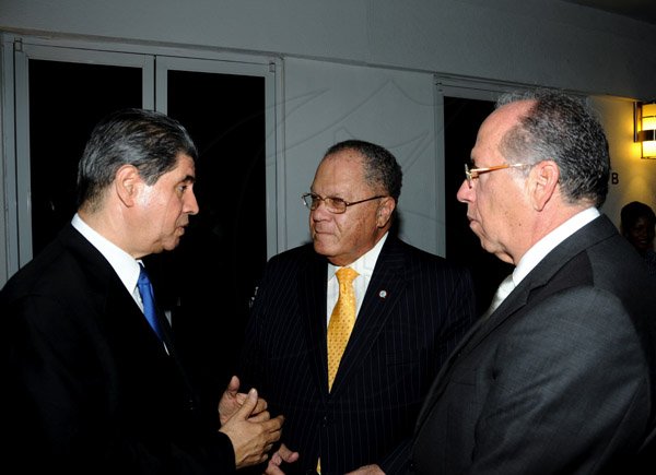 Winston Sill / Freelance Photographer
JAMPRO host welcome dinner for visiting Directors  of the World Federation of Consuls, held at Spanish Court Hotel, St. Lucia Avenue on Thursday night January 24, 2013. Here are Jorge E. Constantino (left), Ambassador of Panama; Arnold Foote (centre), President, World Federation of Consuls; and ---???? (right).