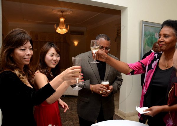 Winston Sill/Freelance Photographer
Outgoing Japanese Ambassador Yasuo Takase, his wife Sayoko Takase and daughter Yuria Takase host a Reception and Dinner for some of their close and special jamaican friends, held at Seaview Avenue on Friday night March 20, 2015.  Here are Sayoko Takase (left); Yuria Takase (second left); Minister Anthony Hylton (centre); and Marcia Thwaites (right).