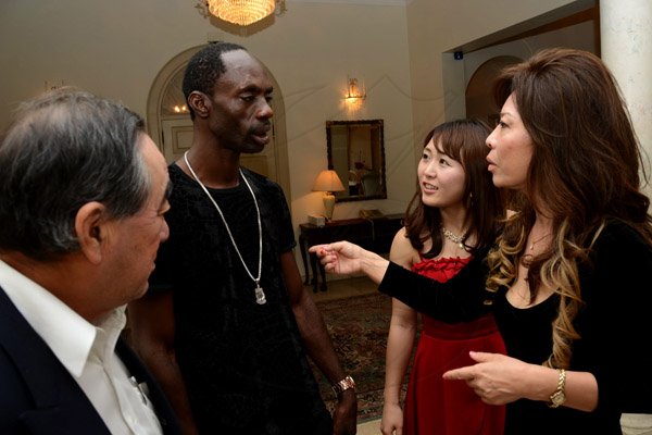Winston Sill/Freelance Photographer
Outgoing Japanese Ambassador Yasuo Takase, his wife Sayoko Takase and daughter Yuria Takase host a Reception and Dinner for some of their close and special jamaican friends, held at Seaview Avenue on Friday night March 20, 2015. Here are Ambassador Takase (left); Ninjaman (second left); Yuria Takase (second right); and Sayoko Takase (right).