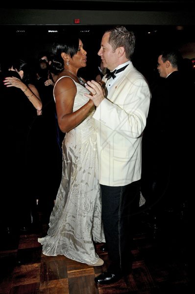 Winston Sill / Freelance Photographer
Scotiabank President Bruce Bowen snuggles up to wife Suzann.

The Civic Affairs Committee of the Jamaica Chamber of Commerce 30th annnual Grand Charity Ball,  held at the Jamaica Pegasus Hotel, New Kingston on Saturday night November 5, 2011.