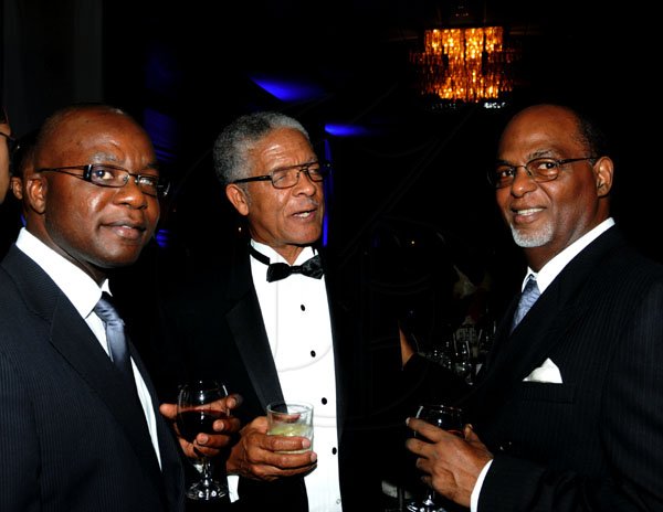 Winston Sill / Freelance Photographer
Stately gentlemen (from left) Lennox McLeod, Llewelyn Bailey and Lester Garnett knock back a few. 

The Civic Affairs Committee of the Jamaica Chambern of Commerce 30th annual Grand Charity Ball, held at the Jamaica Pegasus Hotel, New Kingston on Saturday night November 5, 2011.