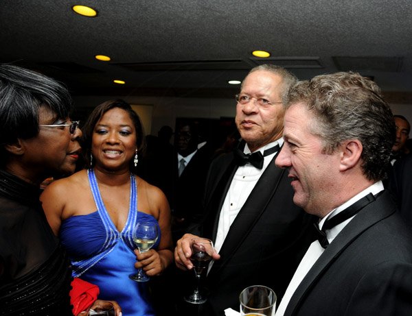 Winston Sill / Freelance Photographer
Jamaica Chamber of Commerce (JCC) 31st Annual Awards Ceremony, held at the Jamaica Pegasus Hotel, New Kingston on Thursday night March 21, 2013. Here are Lorna Golding (left); ---???? (second left); Bruce Golding (second right); and Andy Thorburn (right).