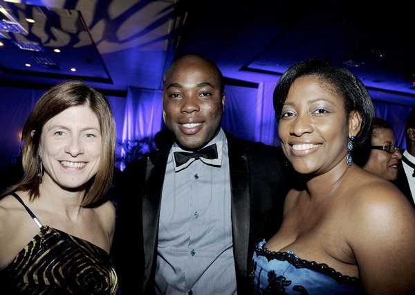 Winston Sill / Freelance Photographer
Jamaica Chamber of Commerce (JCC) 31st Annual Awards Ceremony, held at the Jamaica Pegasus Hotel, New Kingston on Thursday night March 21, 2013. Here are Michelle English (left); Nathaniel Palmer?? (centre); and Tanikie McClarthy (right).