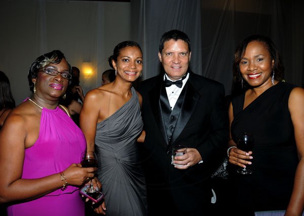 Winston Sill / Freelance Photographer
The Jamaica Chamber of Commerce (JCC) Civic Affairs Committee annual Grand Charity Ball, held at the Jamaica Pegasus Hotel, New Kingston on Saturday night November 3, 2012. Here are Loretta Anderson (left); Candice Hamilton (second left); William Craig (second right); and Joyce DeSousa (right).