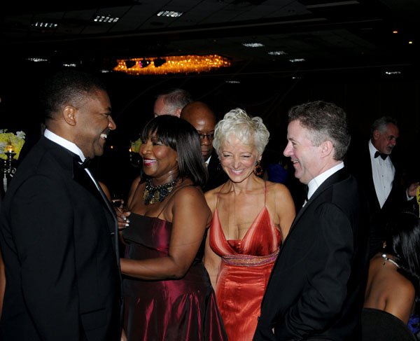 Winston Sill / Freelance Photographer
The Jamaica Chamber of Commerce (JCC) Civic Affairs Committee annual Grand Charity Ball, held at the Jamaica Pegasus Hotel, New Kingston on Saturday night November 3, 2012. Here are Minister Phillip Paulwell (left); Marilyn Bennett (second left); Kelly Tomblin (second right); and Andy Thorburn (right).