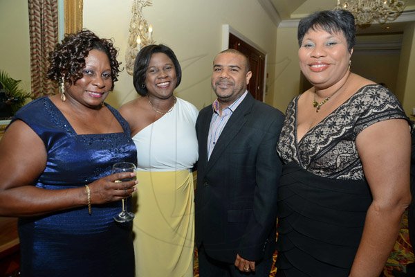 Rudolph Brown/Photographer
Dianna Blake-Bennet, (right) Marketing and Event Manager of Centralized Strategic Services (CSS) pose with from left Hope Mowatt, Tamara Garel Thompson and Roger Thompson at the JCCUL 72nd anniversary Dinner and awards Banquet at the Ritz Carlton on Saturday, May 17, 2013