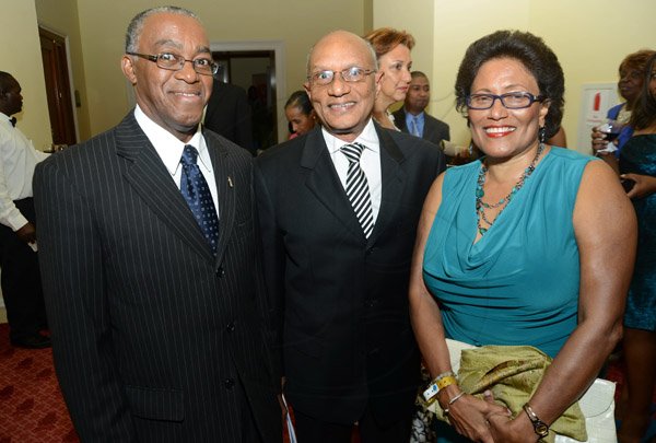 Rudolph Brown/Photographer
Professor Trevor Munroe, (centre) and his Ingrid Munroe, chat with Johnathan Brown,(left) President of the JCCUL at the JCCUL 72nd anniversary Dinner and awards Banquet at the Ritz Carlton on Saturday, May 17, 2013