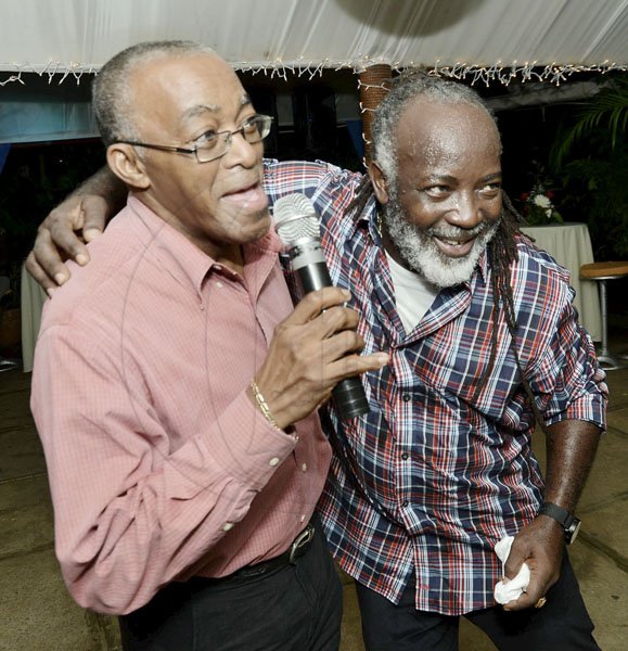 Rudolph Brown/Photographer
Johanthan Brown, (left) president of Jamaica Cooperative Credit Union League greets Freddy McGreagor after he perform at the Jamaica Co-operative Credit Union League 70’s Soiree Charismas party at the Boone Hall Oasis, Stony Hill. on Saturday December 8, 2012