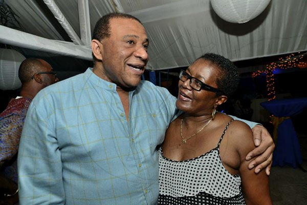 Rudolph Brown/Photographer
BUSINESS DESK
Basil Naar, chief executive officer of FHC, greets Phillipa Beckford at the Jamaica Co-operative Credit Union League 70’s Soiree Chrishmas party at the Boone Hall Oasis, Stony Hill. on Saturday December 8, 2012