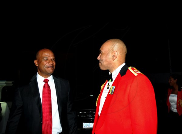 Winston Sill / Freelance Photographer
Major General Antony Anderson, Chief of Defence Staff host Cocktail Party,held at the Flagstall Officers' Mess, Up Park Camp on Saturday night December 1, 2012. Here are Minister Peter Bunting (left); and Major Gen. Anderson (right),