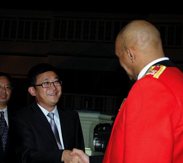 Winston Sill / Freelance Photographer
Major General Antony Anderson, Chief of Defence Staff host Cocktail Party,held at the Flagstall Officers' Mess, Up Park Camp on Saturday night December 1, 2012. Here are Chinese Ambassador Zheng Qingdian (left); and Major Gen. Anderson (right).