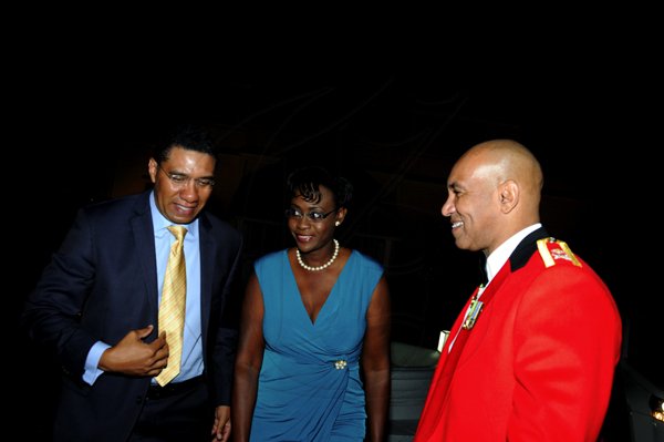 Winston Sill / Freelance Photographer
Major General Antony Anderson, Chief of Defence Staff host Cocktail Party,held at the Flagstall Officers' Mess, Up Park Camp on Saturday night December 1, 2012. Here Andrew Holness (left), opposition leader; Juliet Holness (centre); and Major Gen. Anderson (right).