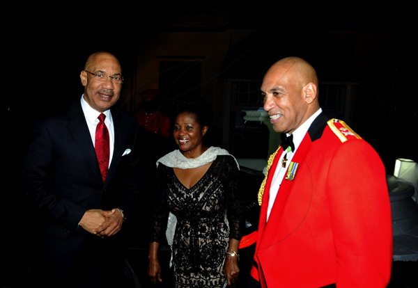 Winston Sill / Freelance Photographer
Major General Antony Anderson, Chief of Defence Staff host Cocktail Party,held at the Flagstall Officers' Mess, Up Park Camp on Saturday night December 1, 2012. Here Major Gen. Anderson (right) greets Governor General Sir Patrick Allen and Lady Allen on their arrival.
