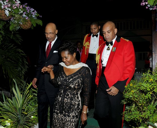Winston Sill / Freelance Photographer
Major General Antony Anderson, Chief of Defence Staff host Cocktail Party,held at the Flagstall Officers' Mess, Up Park Camp on Saturday night December 1, 2012. Here are Governor General Sir Patrick Allen and Lady Allen (in front); Major Gen. Anderson (right); and the GG ADC (backgroung).