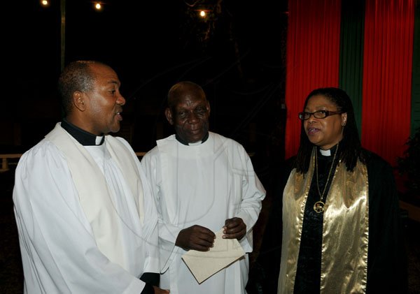 Winston Sill / Freelance Photographer
Rev Major Denston Smalling (left), chaplain of The Jamaica Defence Force chats with colleague chaplain Rev Dr Webster Edwards and Rev Dr Marjorie Lewis, president of the United Theological College of the West Indies.

(JDF) annual Carol Service in the Open Air, held at Up Park Camp on Tuesday night December 11, 2012.