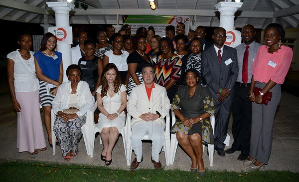 Winston Siill/Freelance Photographer
Japanese Ambassador Yasuo Takase and his wife Sayoko Takase host Send-Off Reception and Dinner for JET Representatives, held at Seaview Avenue, St. Andrew on Friday night June 27, 2014. Here seated are Marcia Thwaites (left), wife of Minister of Education Ronald Thwaites; Sayoko Takase (second left); Ambassador Takase (second right); and Claudia Barnes (right), former Ambassador of Jamaica to Japan, pose with the JET Representatives.