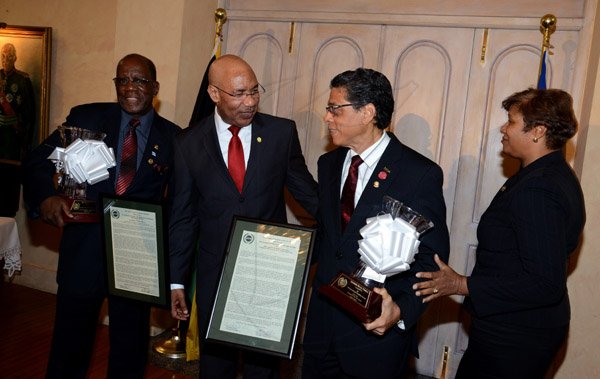 Winston Sill/Freelance Photographer
The Jamaica Institute of Management (JIM) Limited presents the JIM  2013 Manager of the Year Award Ceremony, held at King's House on Thursday evening May 29, 2014. Here are Dr. Henley Morgan (left), Entrepreneurship and Community Development Award winner; Governor General Sir Patrick Allen (second left);  Richard Powell (second right), Managing Director, VMBS, JIM Manager of the Year winner; and Sandra Shirley (right), Chairman, JIM (2009) Limited.