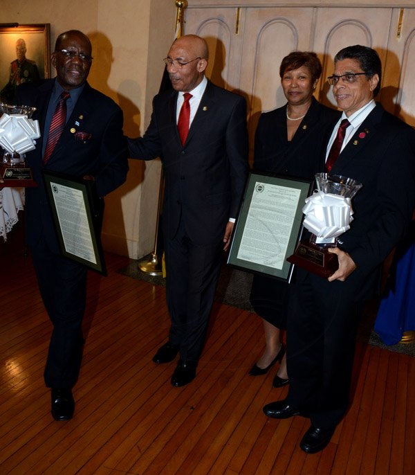 Winston Sill/Freelance Photographer
The Jamaica Institute of Management (JIM) Limited presents the JIM  2013 Manager of the Year Award Ceremony, held at King's House on Thursday evening May 29, 2014. Here are Dr. Henley Morgan (left), Entrepreneurship and Community Development Award winner; Governor General Sir Patrick Allen (second left); Sandra Shirley (second right), Chairman, JIM (2009) Limited; and Richard Powell (right), Managing Director, VMBS, JIM Manager of the Year.