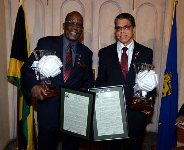Winston Sill/Freelance Photographer
The Jamaica Institute of Management (JIM) Limited presents the JIM  2013 Manager of the Year Award Ceremony, held at King's House on Thursday evening May 29, 2014. Here are Dr. Henley Morgan (left), Entrepreneurship and Community Development Award winner; and Richard Powell (right), Managing Director, VMBS, JIM Manager of the Yaer winner.