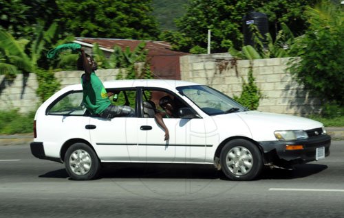 Norman Grindley/Chief Photographer
JLP supporters heading to the Jamaica Labour Party 68th annual conference at the National Arena in St Andrew. Sunday November 20, 2011