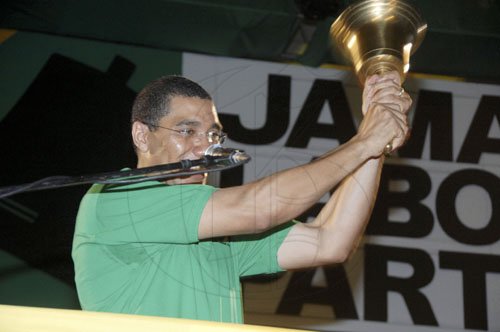 Ian Allen/Photographer
Jamaica Labour Party Leader Andrew Holness rings the bell, teasing supporters before announcing that he was not ready to call the election.