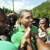 Ian Allen/Photographer
Prime Minister Andrew Holness is greeted by supporters at Whitney Turn in Manchester during a tour of the parish yesterday.