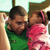 Gladstone Taylor / Photographer
Prime Minister Andrew Holness listens to a little one during his dash across the country earlier this week.