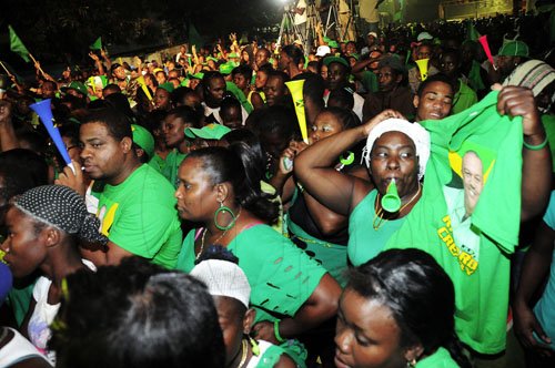 Gladstone Taylor / Photographer
Supporters of the JLP in a jubilant mood  during the party's three-day islandwide tour on Wednesday.