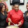 Rudolph Brown/Photographer
Jacqui Tyson, (centre) prepare pasta while Tavia Delisser, (left) and Lorraine Kemble looks on at the Best Dressed booth at the JMA/JEA Expo 2014 at the National Arena
