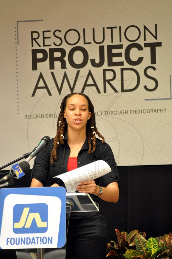 Jermaine Barnaby/Photographer
Amashika Lorne project officer JN foundation resolution project outlines the years activities at the JN Foundation Resolution Project Awards Ceremony at the Olympia Gallery- 202 Old Hope Road on Tuesday, July 15, 2014.