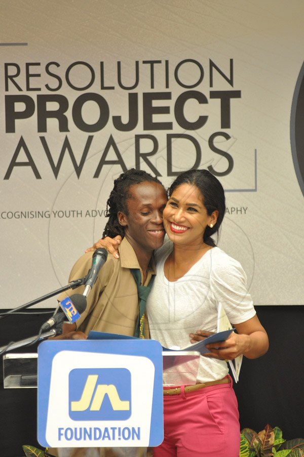 Jermaine Barnaby/Photographer
Lisa Hanna Minister of Youth and Culture shares a moment with Osheenei Graham of Grange Hill High as he introduced her at the JN Foundation Resolution Project Awards Ceremony at the Olympia Gallery- 202 Old Hope Road on Tuesday, July 15, 2014.