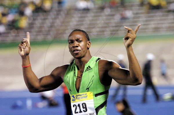 Ricardo Makyn/Staff Photographer
Yohan Blake acknowledges the crowd after his wind-aided 9.80-second victory in the men's 100 metres, at the JN Jamaica International Invitational meet, at the National Stadium on Saturday night.


 7.5.2011