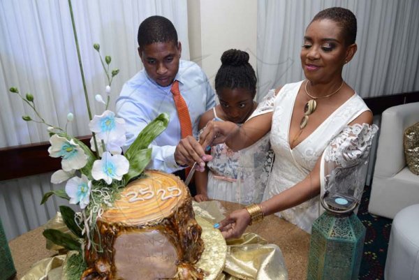 Rudolph Brown/ PhotographerBirthday girl Joan Forrest-Henry, cutting her cake with kids Brandon and Kaelia Henry at her 25/25 birthday celebration with families and friends at the Jamaica Pegasus Hotel in New Kingston on Saturday, June 30, 2018