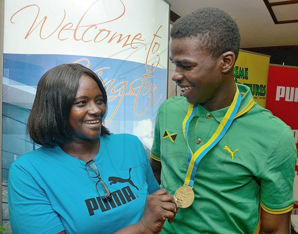 Ian Allen/Staff Photographer
Junior Athlete Michael Ohara and his mother Kereen Williams upon his arrival at the Norman Manley Airport from the 
World Youth Cahampionships in Ukraine.