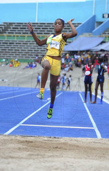 Ricardo Makyn/Staff Photographer
Ginelle Grant of John Mills winner of the Girls Class 2 Long jump with a leap of 4.56 Meter at the Junior High Schools track and field Championsips  2012 at the National Stadium day one at the National Stadium on Thursday 19.4.2012