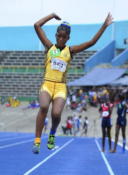 Ricardo Makyn/Staff Photographer
Ginelle Grant of John Mills winner of the Girls Class 2 Long jump with a leap of 4.56 Meter at the Junior High Schools track and field Championsips  2012 at the National Stadium day one at the National Stadium on Thursday 19.4.2012
