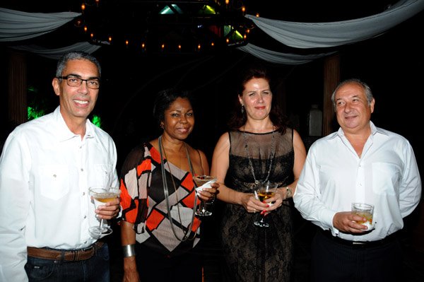 Winston Sill/Freelance Photographer
Guardsman Group Chairman Kenny Benjamin 60th Birthday  and  Appreciation Party with Family and a host of Friends,  held at Montgomery Road, Stony Hill on Saturday night July 13, 2013. Here are Richard Byles (left); Jascinth Byles (second left); Elena Dorofeeva (second right); and Igor Dorofeeva (right).