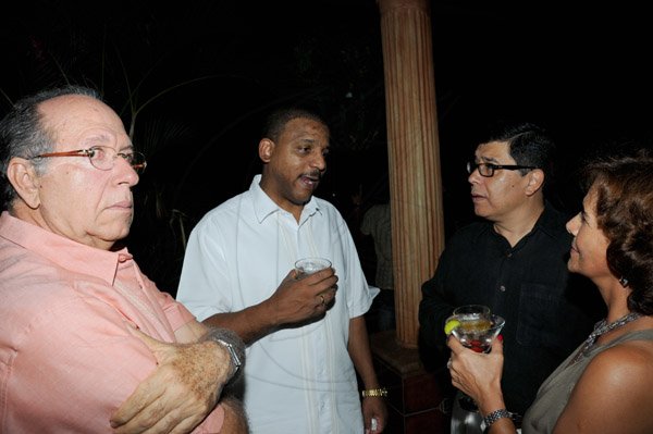 Winston Sill/Freelance Photographer
Guardsman Group Chairman Kenny Benjamin 60th Birthday  and  Appreciation Party with Family and a host of Friends,  held at Montgomery Road, Stony Hill on Saturday night July 13, 2013. Here are ???? (left); Yuri Gala Lopez (second left), Cuban Ambassador; Gerardo Lozano (second right), Mexican Ambassador; and Mariza Lozano (right).