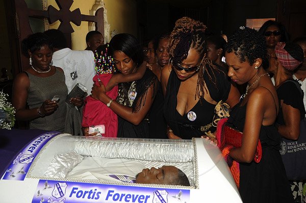Ian Allen/Photographer
Relatives and friends of Khajeel Mais pay thier final respect to him while attending his funeral service at the Holy Trinity Cathedral on saturday.