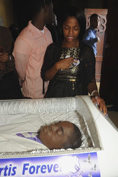 Ian Allen/Photographer
KImberly Mais weep over over brothers Khajeel Mais body during the funeral service at the Holy Trinity Cathedral on saturday.
