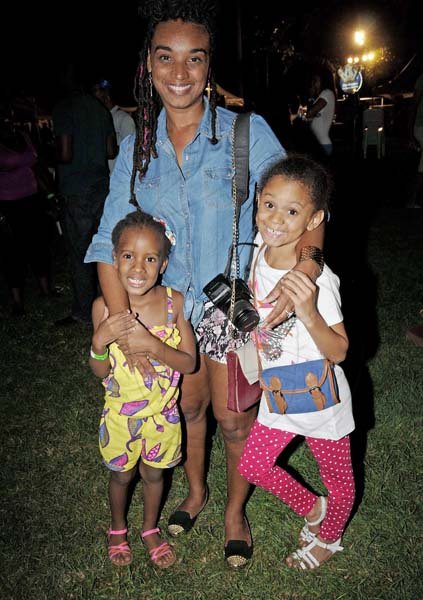 Winston Sill/Freelance Photographer
Maria Hitchins shares the spotlight with her daughter Milan Russell (left) and niece Jordanne Hitchins (right) at Kgn Kitchen Night Market on Saturday night.