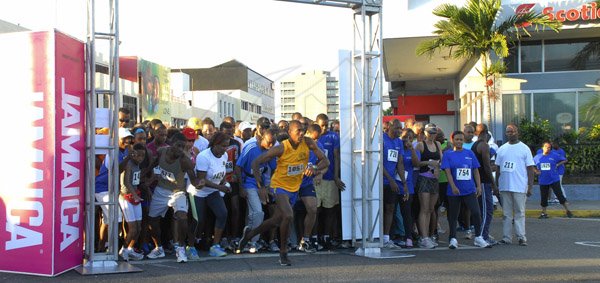 Colin Hamilton/Photographer                                                                                                                                                                                                 The 5K runners are off, it is noteworthy that Kevin Campbell, #1051 in yellow, was first off the line and did a post-to-post win.                                                                                                                                                                                          Kingston City 5K Run - March 10 - Emancipation Park