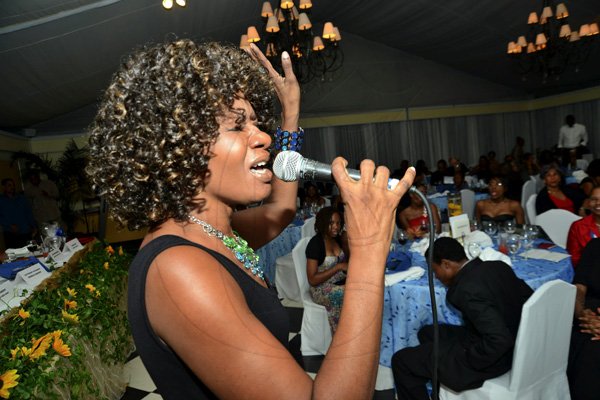 Rudolph Brown/Photographer
Gem Myers singing at the Kiwanis Club of New Kingston Installation Banquet for the 2012 -2013, officers and Board of Directors at the Terra Nova Hotel in Kingston on Wednesday, October 10, 2012