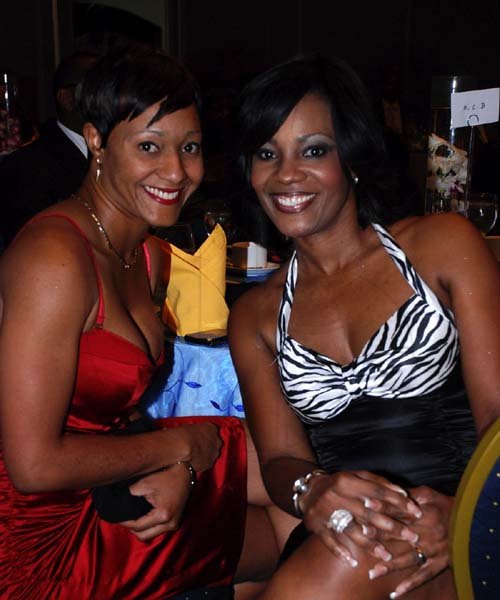 Colin Hamilton/Freelance Photographer
It dosen't get better than this, Najah Peterkin (NCB Capital Markets) and Belinda Williams (NCB Corporate Communications Manager) at the Kiwanis Club of New Kingston Installation Banquet at the Jamaica Pegasus on Wednesday October 12, 2011.