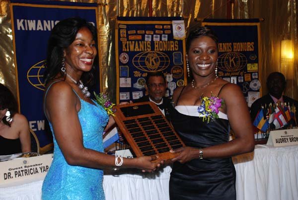 Colin Hamilton/Freelance Photographer
At left, IPP Andrea Moore presents a plaque to President Sharon Williams at the Kiwanis Club of New Kingston Installation Banquet at the Jamaica Pegasus on Wednesday October 12, 2011.