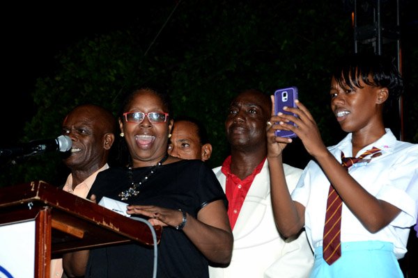 Winston Sill/Freelance Photographer
Kingston and St. Andrew Corporation (KSAC) Christmas Tree Lighting Ceremony and Concert, held at St. William Grant Park, Downtown, Kingston on Wednesday night December 3, 2014. Here Mayor Angela  Brown-Burke (second left) turns on the lights on the tree. Looking on are Custos Steadman Fuller (left); Audley Gordon (second right); and Waynette Strachan (right), KSAC Youth Mayor 2014.