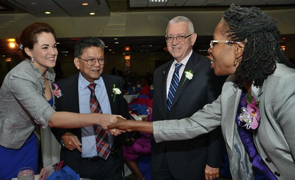 Rudolph Brown/Photographer
BUSINESS DESK
Lascelles Chin, executive chairman of LASCO Affiliated Companies and Dr. Eileen Chin, (left) Managing Director, LASCO Manufacturing greets Elaine Foster-Allen permanent Secretary and Rev. Ronald Thwaites, Minister of Education at the LASCO 2012-2013 Teacher and Principal of the Year Awards at the Wyndham Hotel in New Kingston on Tuesday, December 4, 2012